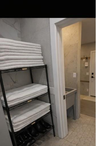 Fresh towel stacks by the changing area.