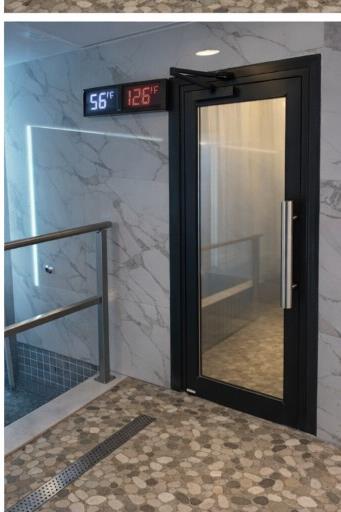 Cold plunge entry with marble walls.