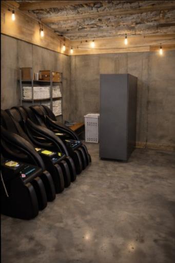 Quiet recovery room with massage chairs.