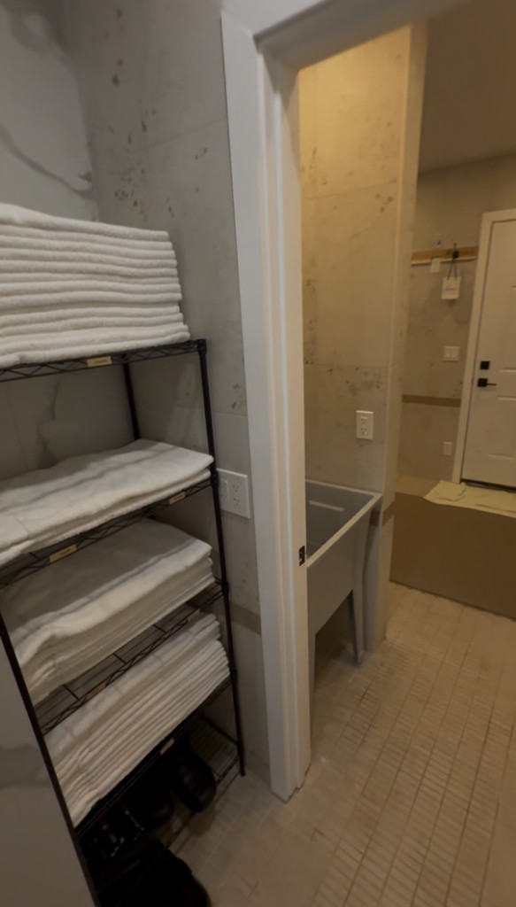 Fresh towel stacks and changing area.